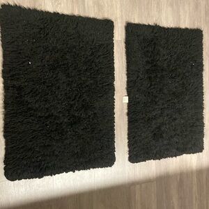 Two small fluffy rugs; slighty heat damaged